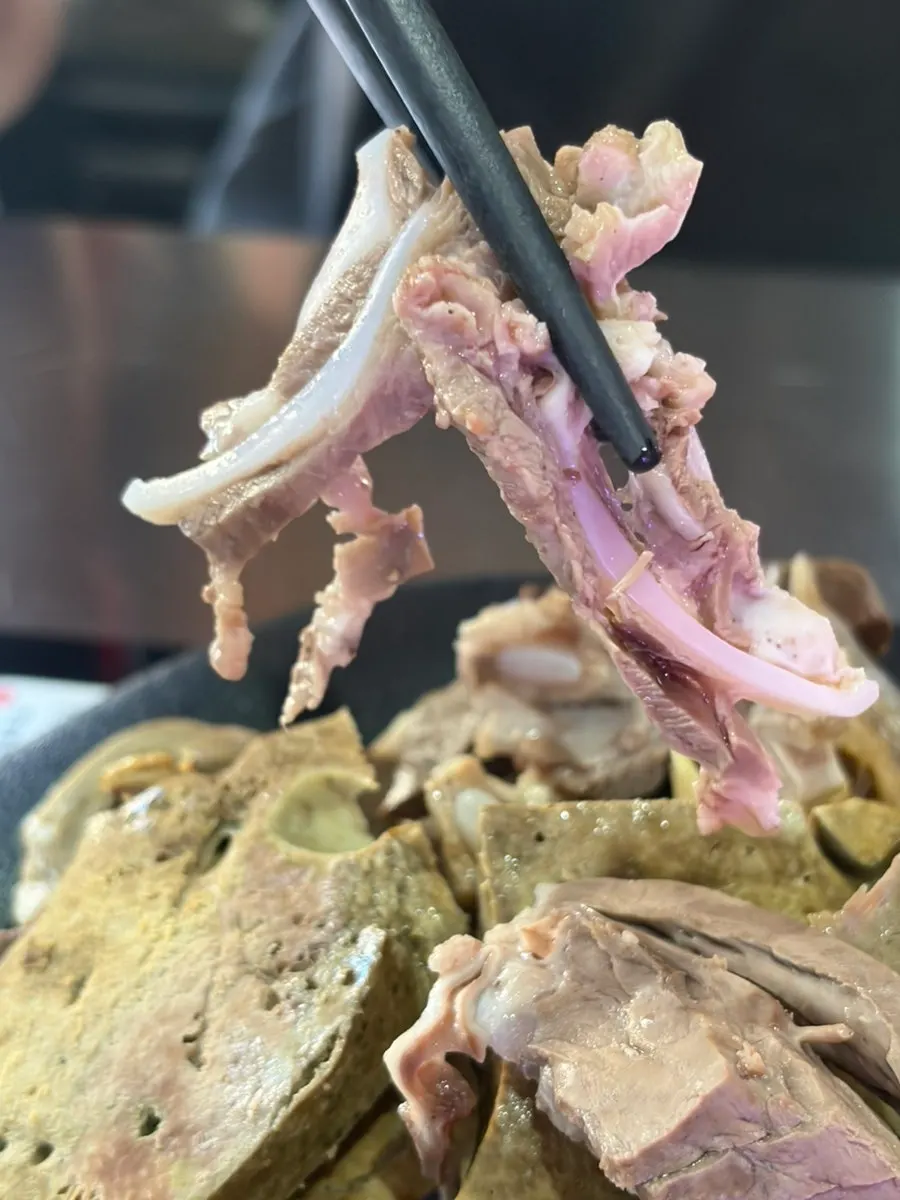Picking up a piece of sundae with innards
