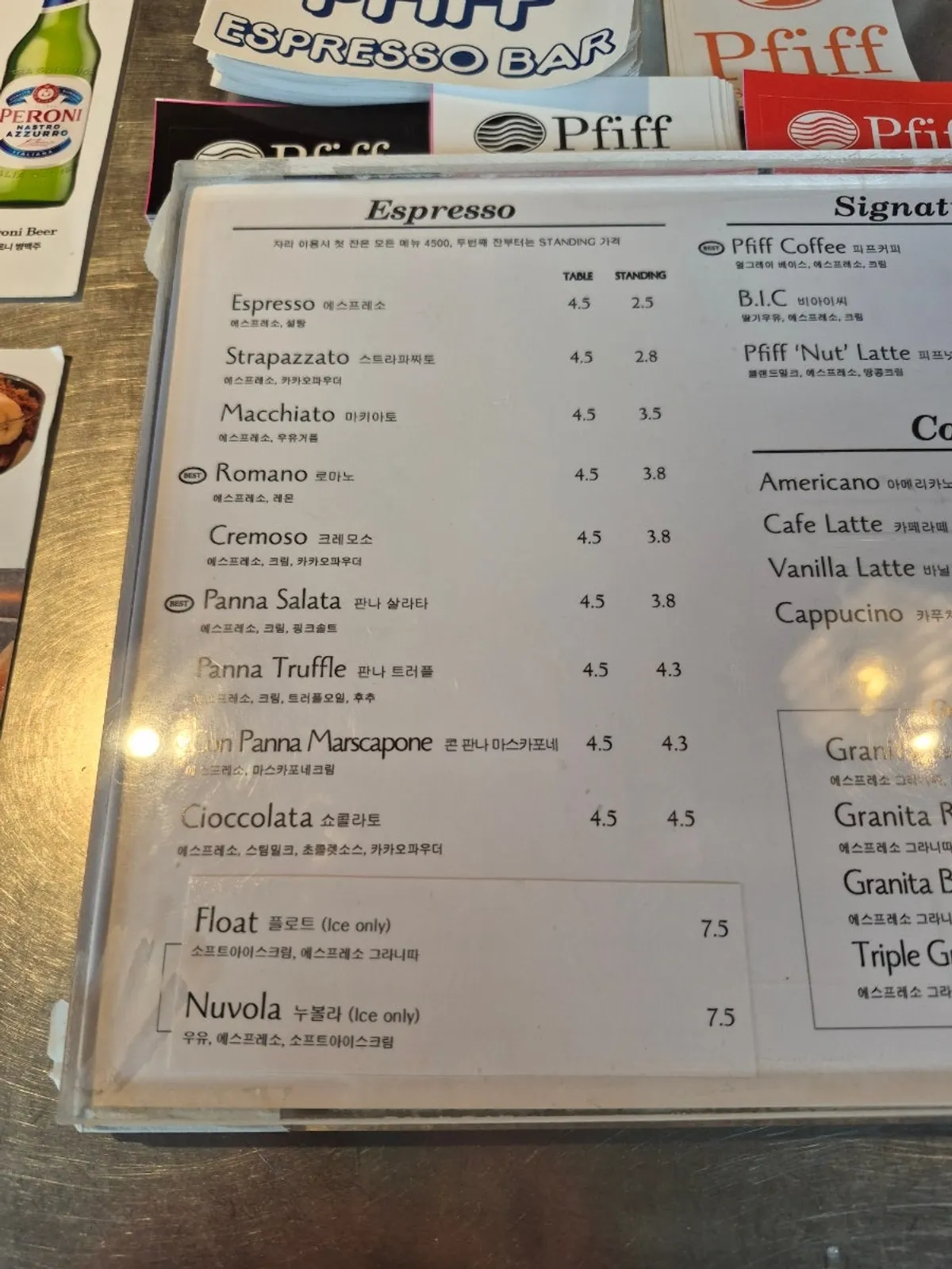 Pip Espresso Bar's bar counter with the coffee menu