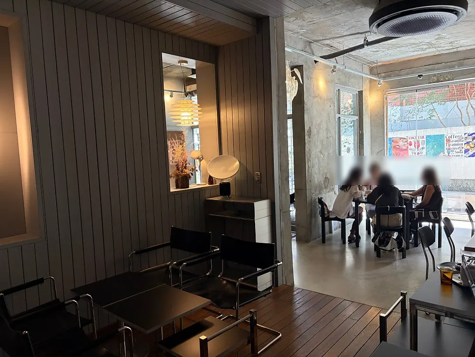 Hall lit by floor-to-ceiling windows