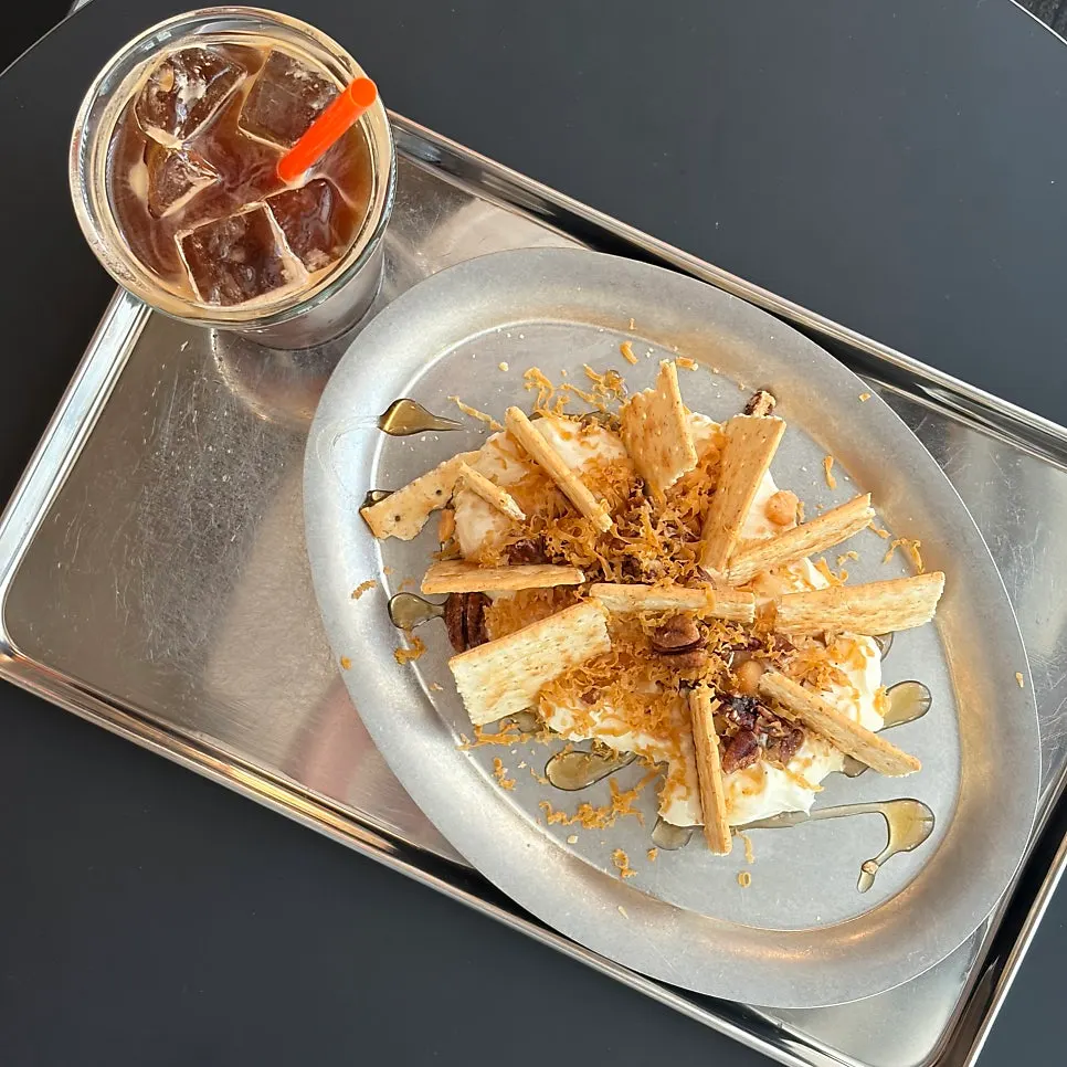 Table with the pecan-macadamia platter and Americano