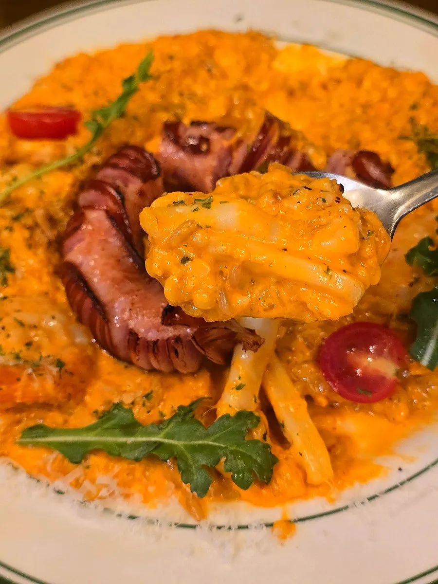 Scooping a bite of the risotto