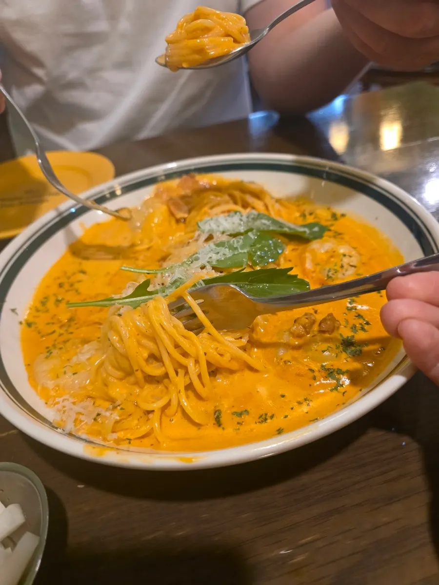 Pasta noodles coated in thick rosé sauce