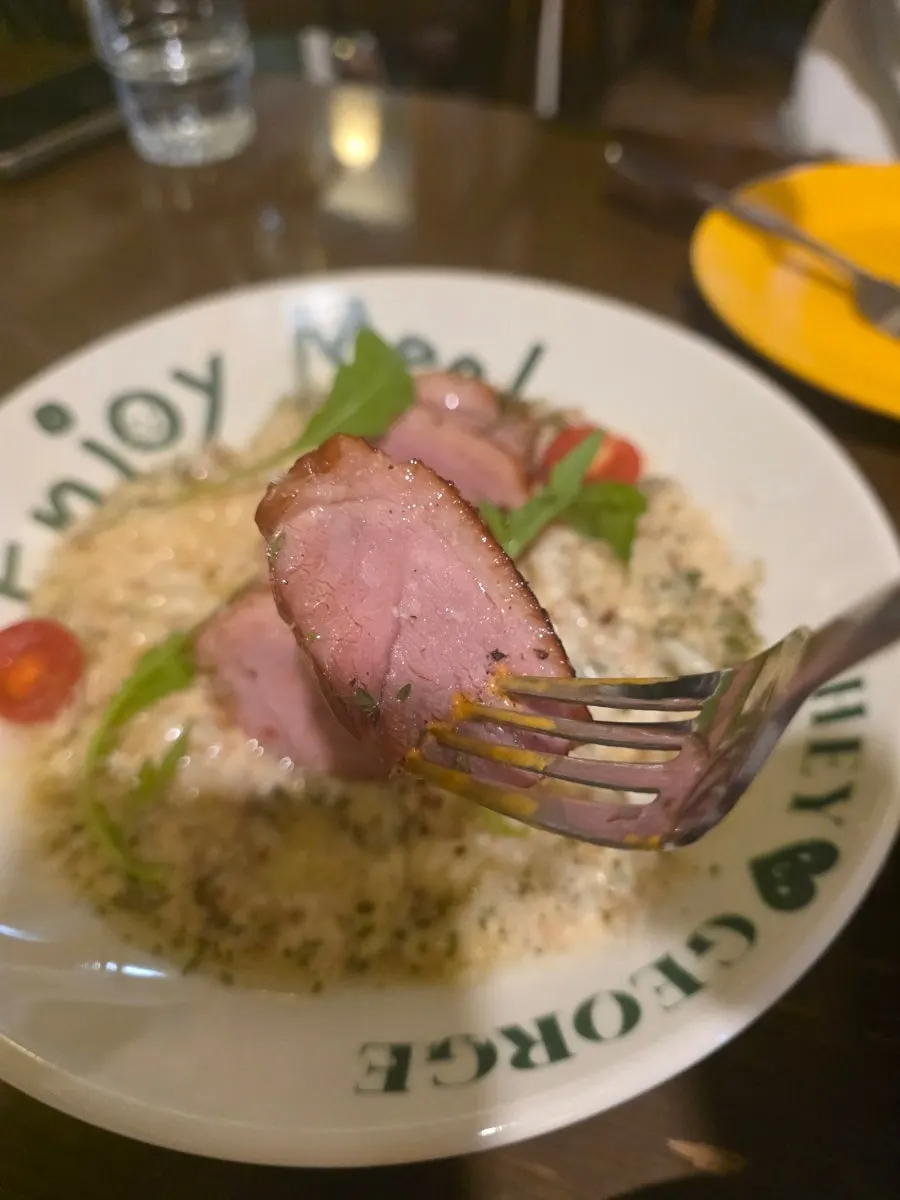 Cream risotto topped with smoked duck