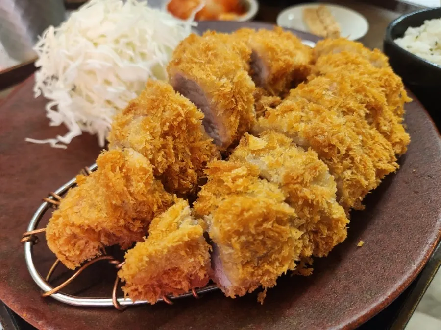 Fillet katsu dipped in sauce with side dishes