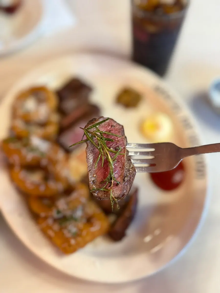 Plated house steak as served