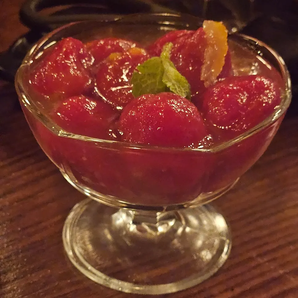 A plate of tomato marinade with yuzu sauce