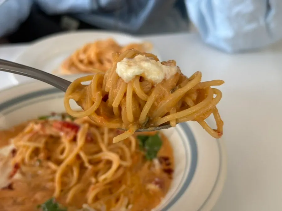 Crab rosé pasta topped with cheese