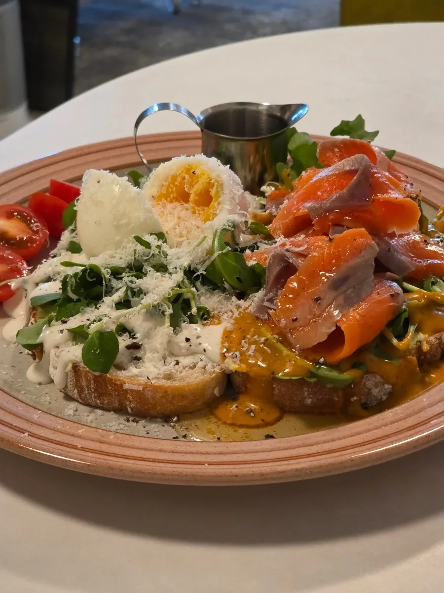 Open sandwich piled with thick salmon slices