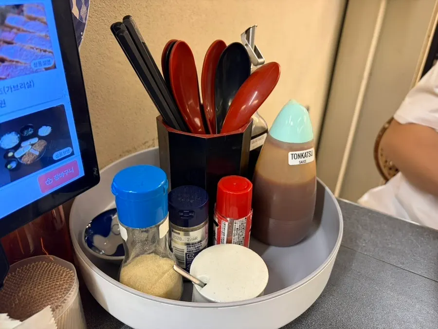 Sauces, salt, and wasabi set out on the table