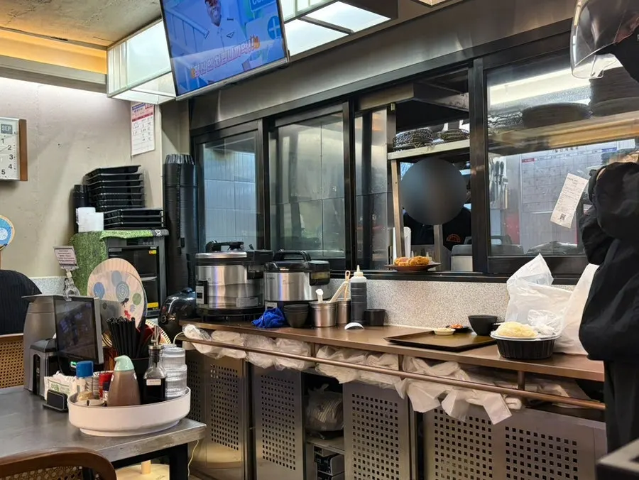 Interior of Katsu Monster Yeonnam Main Branch with view of the open kitchen