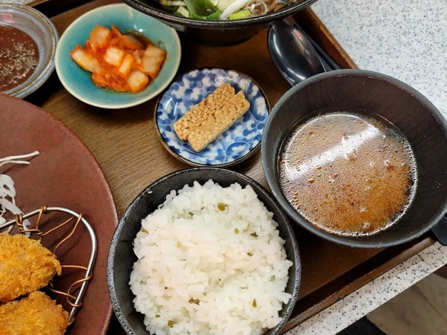 Set spread with kimchi, gangjeong, rice, and miso soup