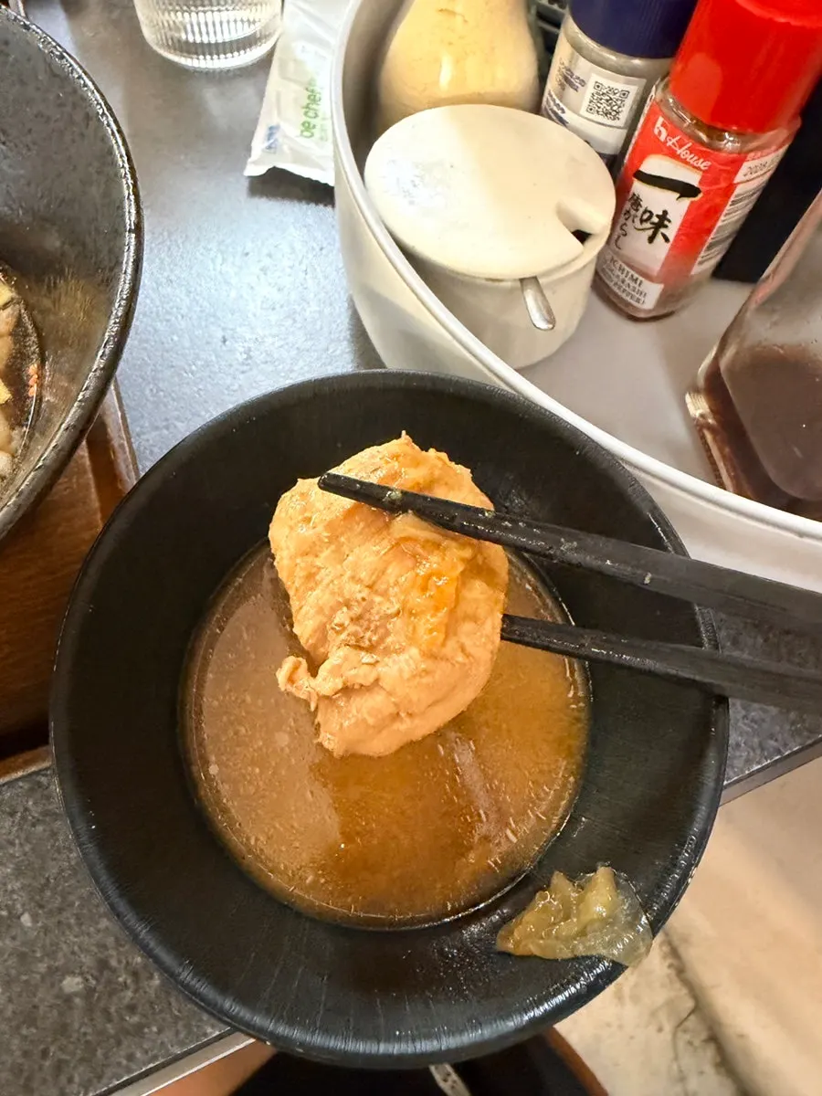 Bowl of clear soup with chicken