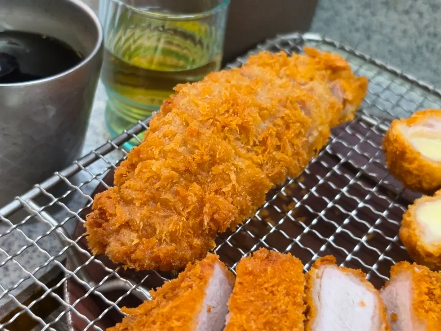 Close-up of a piece of cheese katsu