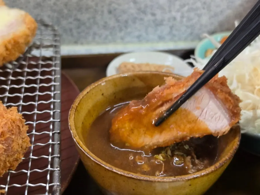 Tonkatsu dipped into spicy curry