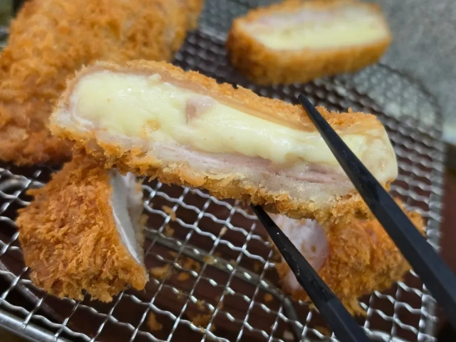 Piece of tonkatsu soaked through with curry