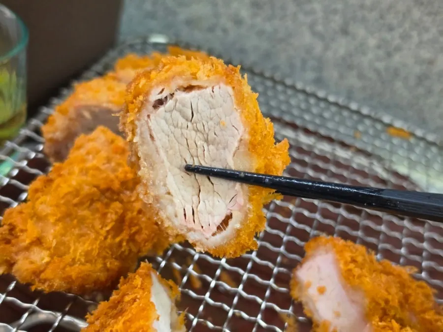 Cross-section of cheese katsu packed with cheese