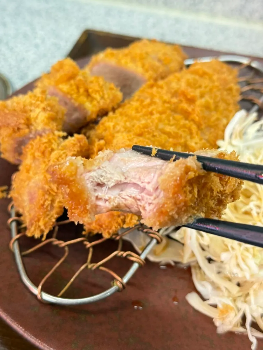 Juicy cross-section of pork tenderloin katsu