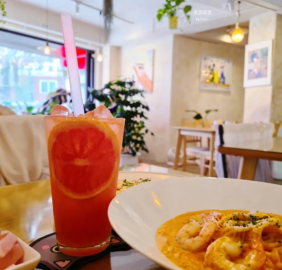 Grapefruit ade set alongside the pasta on the table