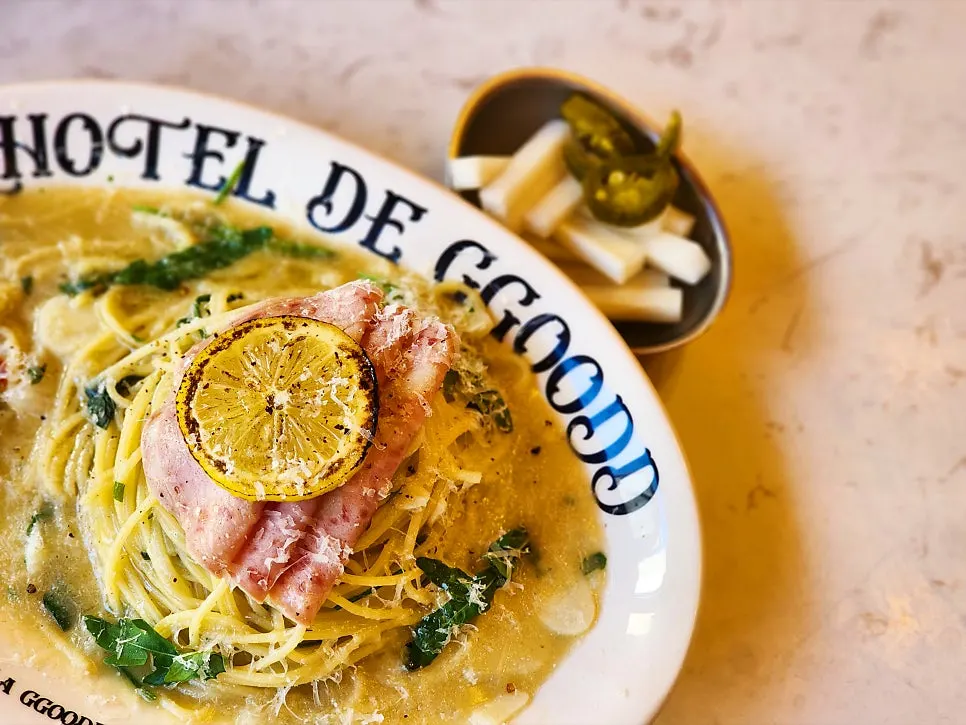 Mortadella pasta topped with grilled lemon