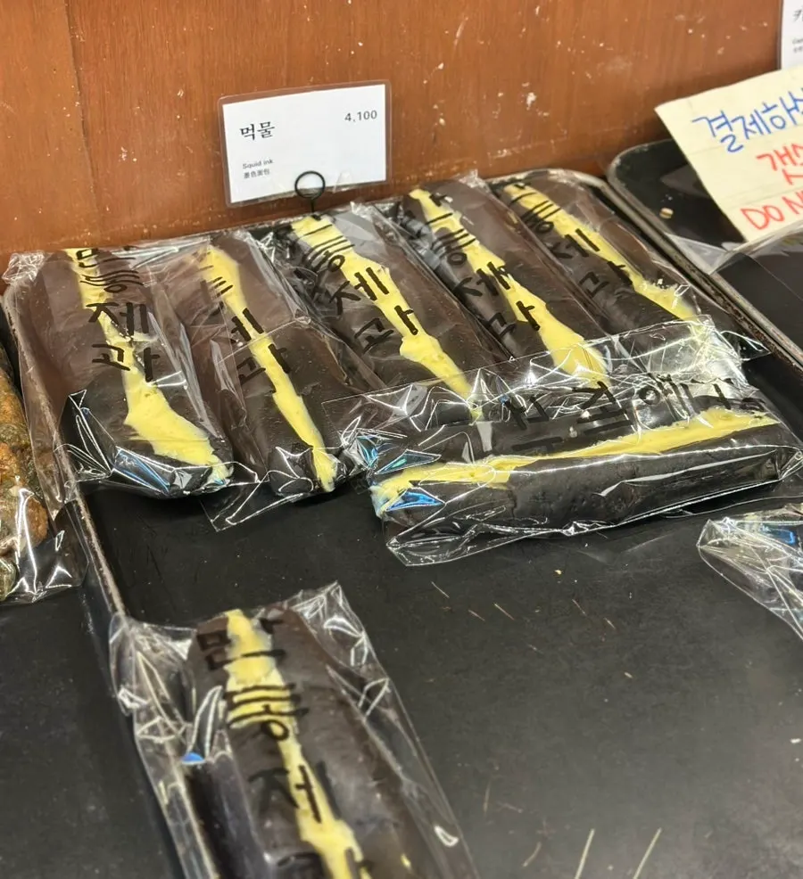 Squid ink bread, corn mayo bread and other displays