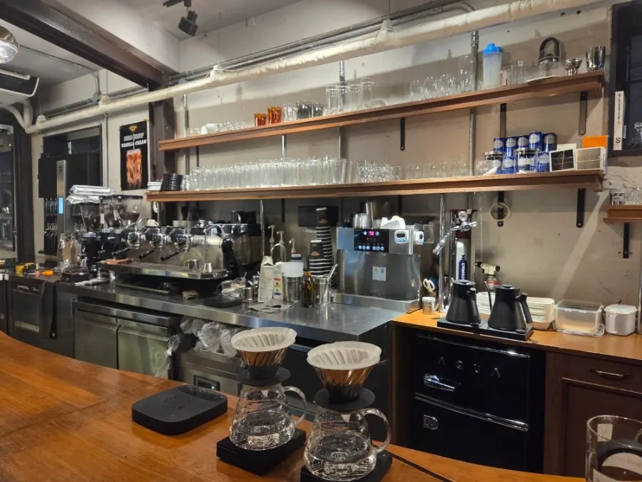 Café interior with a wood-toned bar table