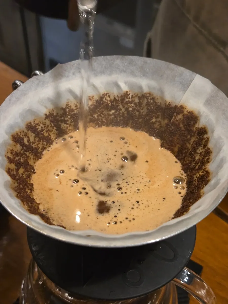 The owner personally demonstrating the coffee-brewing process