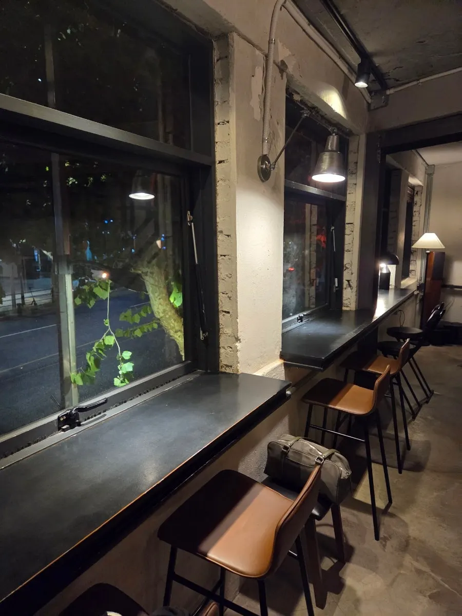 Coffee and dessert enjoyed by a Yeonnam-dong night-street window