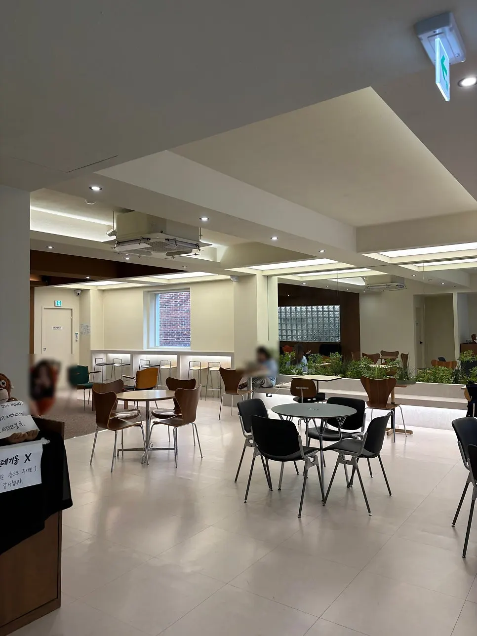 White and wood-toned seating on Noknok's 2nd floor