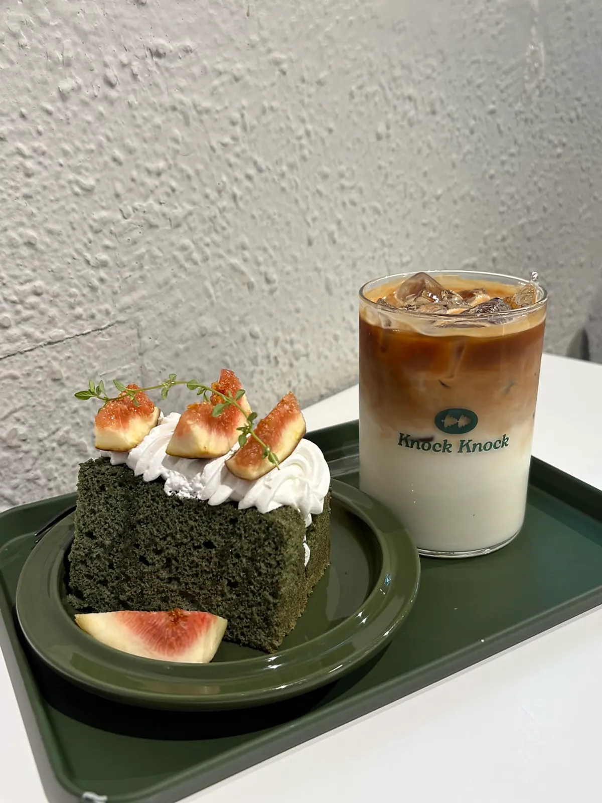 Iced vanilla latte and dessert set on the table