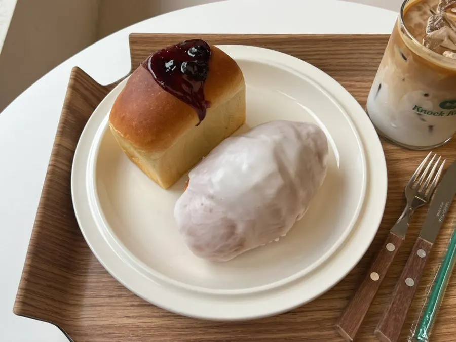 Café latte and two bakery items