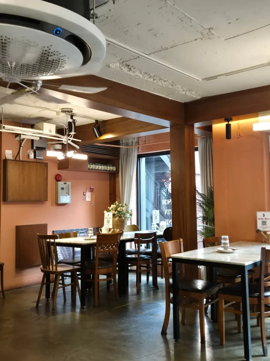 Wood-toned interior of Hôtel de Couture