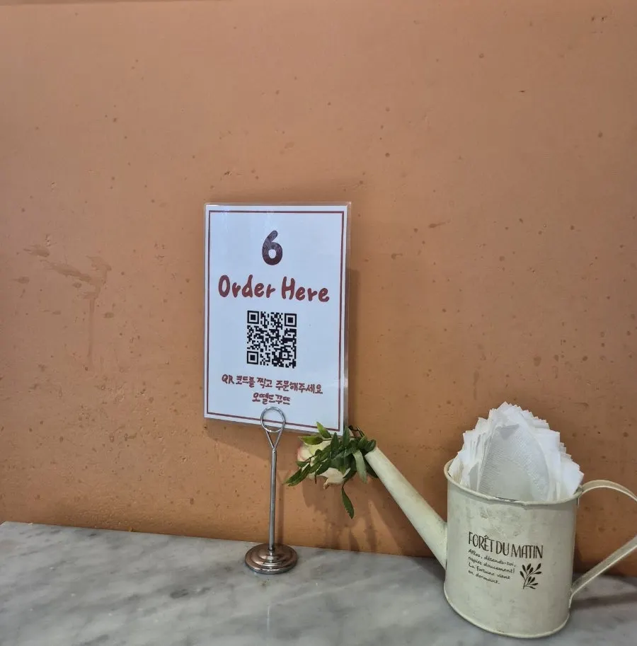 Table with QR code ordering instructions