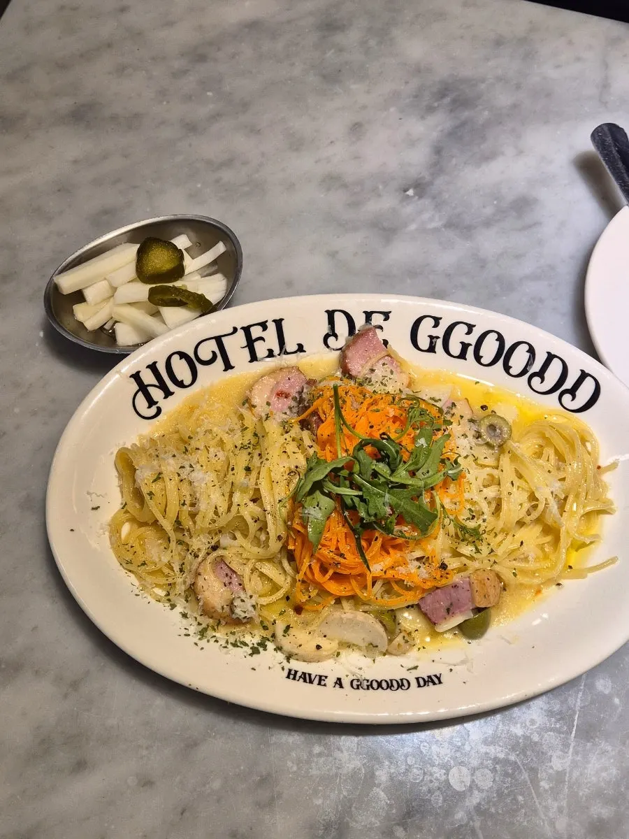 Aglio olio topped with thick smoked duck