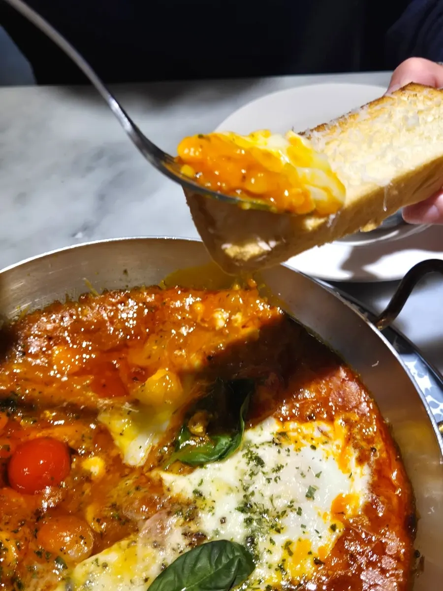 Nearly empty egg in hell plate