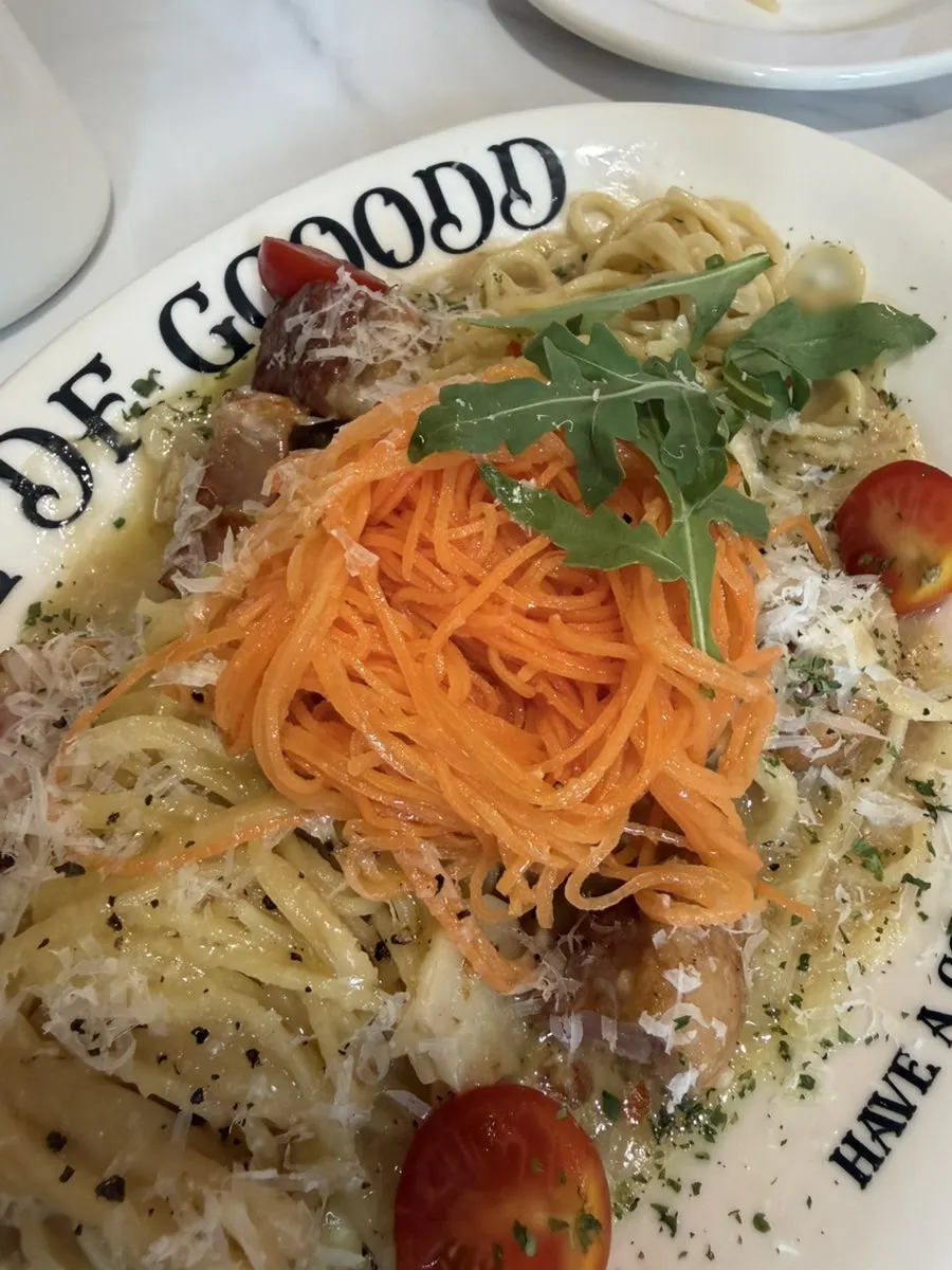 Cream pasta noodles lifted with a fork