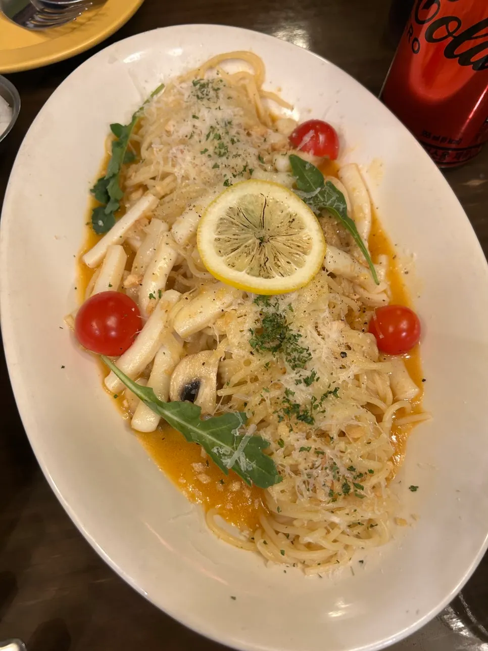 Garlic oil pasta topped with squid and lemon slices