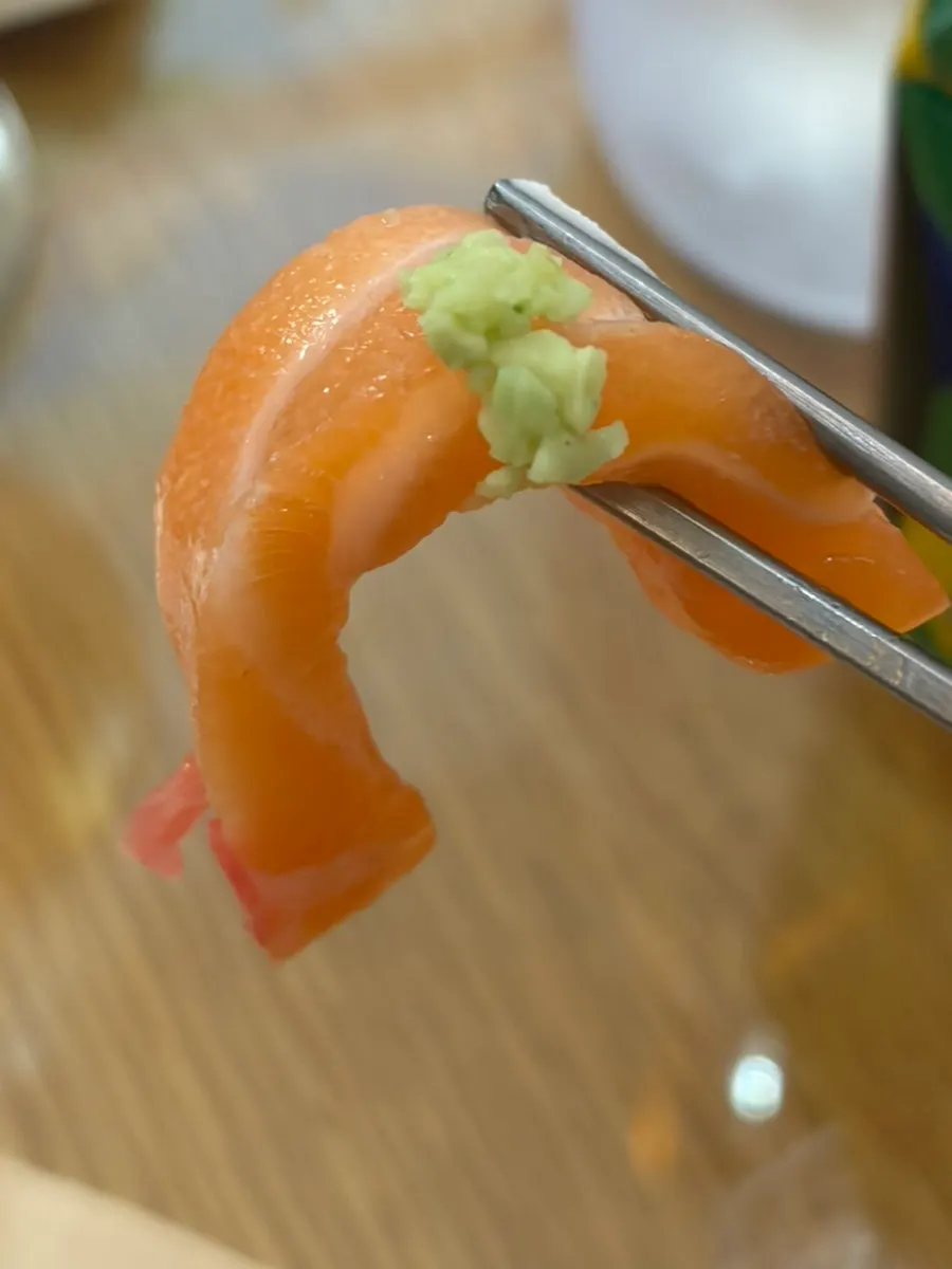 Salmon rice bowl served with wasabi