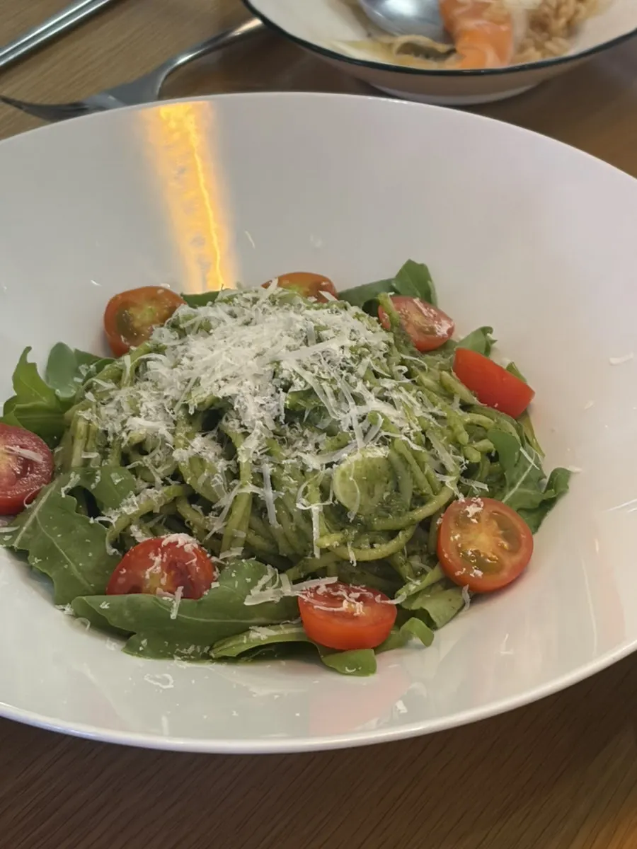 Overhead view of the basil pesto pasta plate