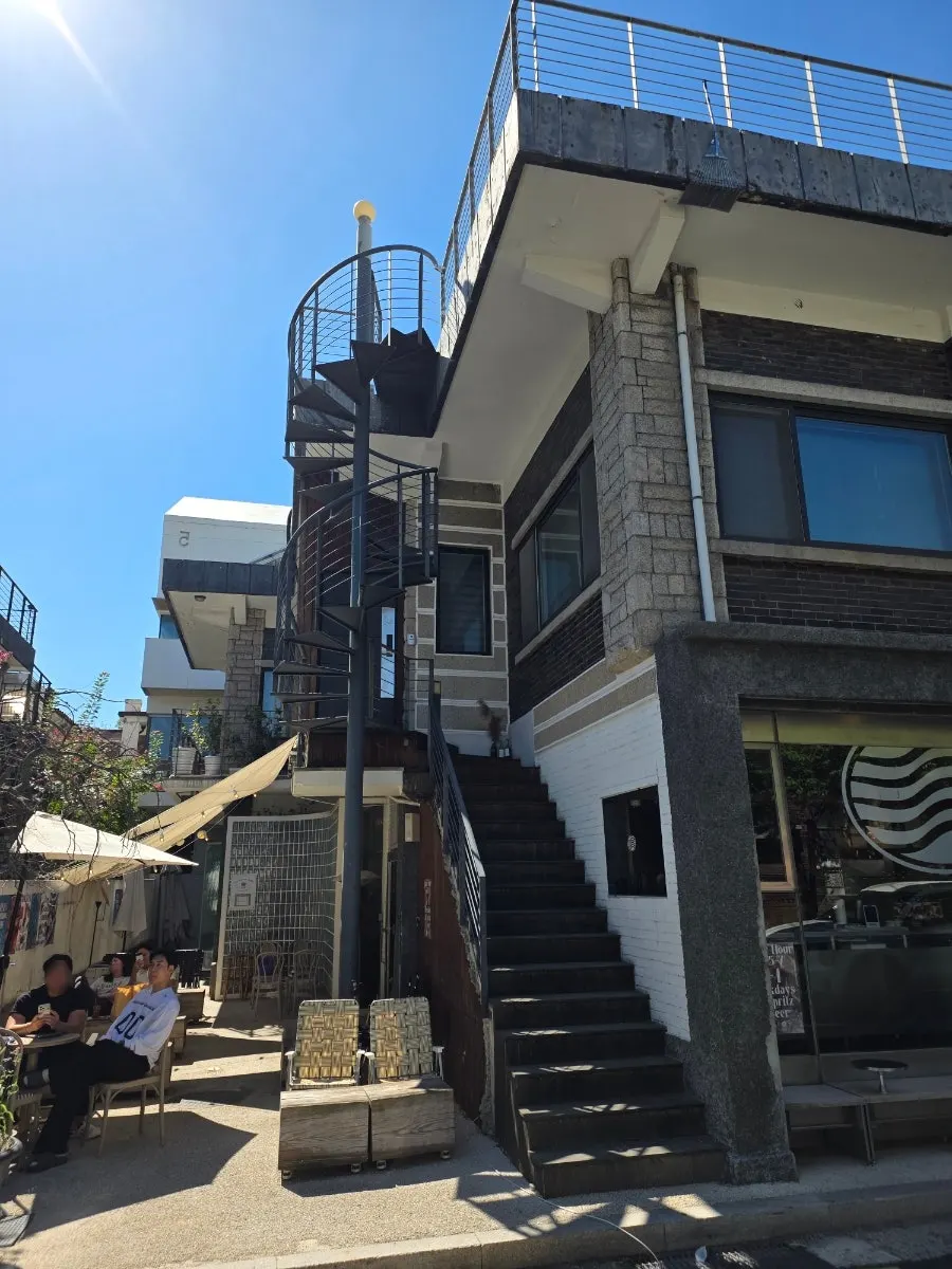 Vertical photo of the exterior staircase at Pip Espresso Bar