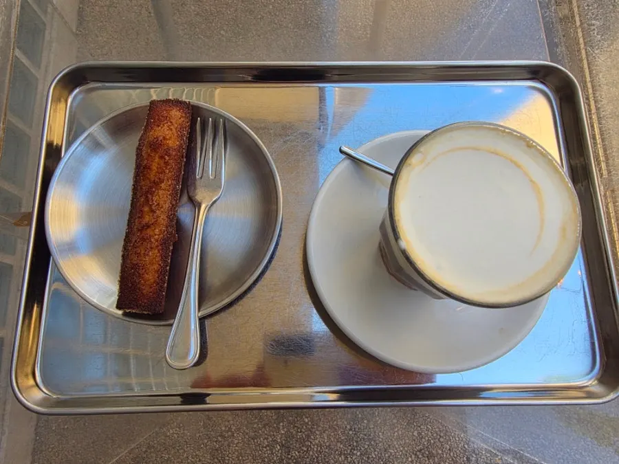 Pip Coffee and classic financier on the outdoor table