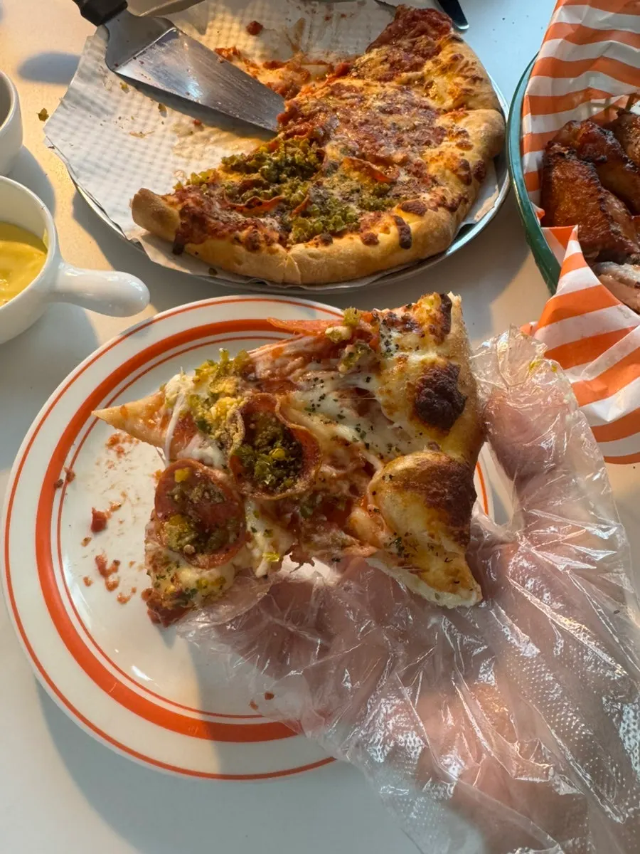 A deliciously eaten pizza slice