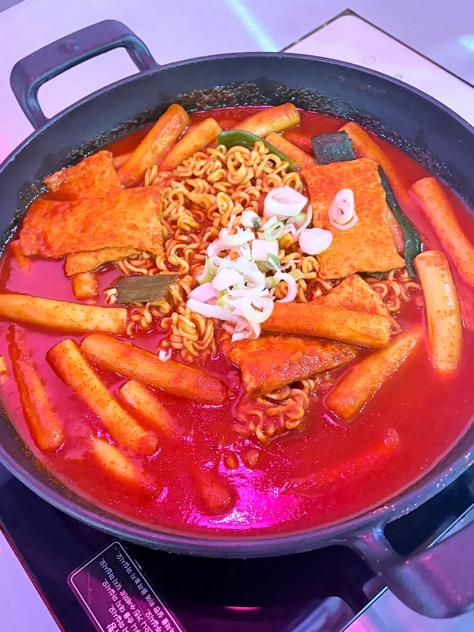 A table spread of rabokki, boneless fried chicken and mini gimbap