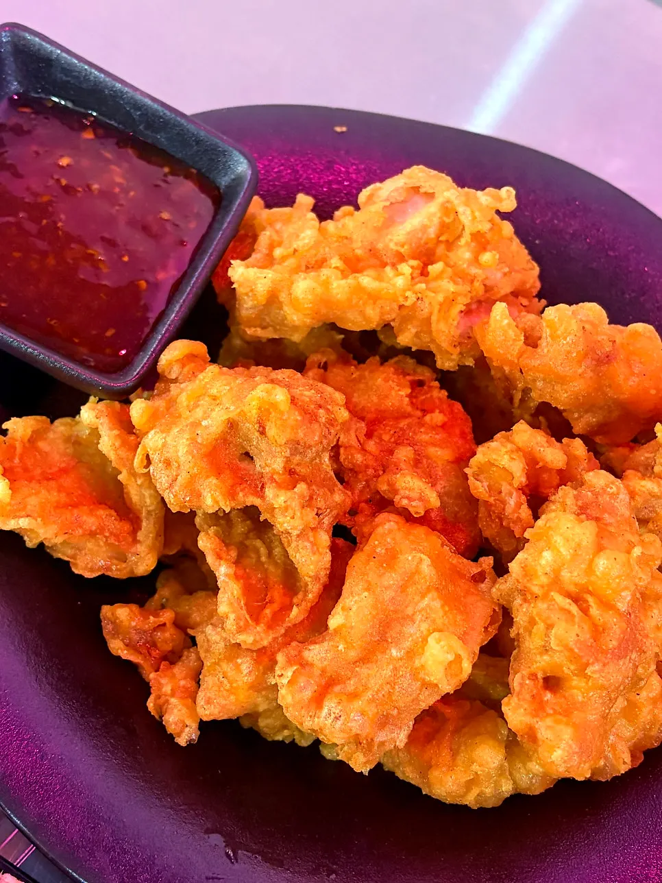 Boneless fried chicken dipped in the seasoned sauce