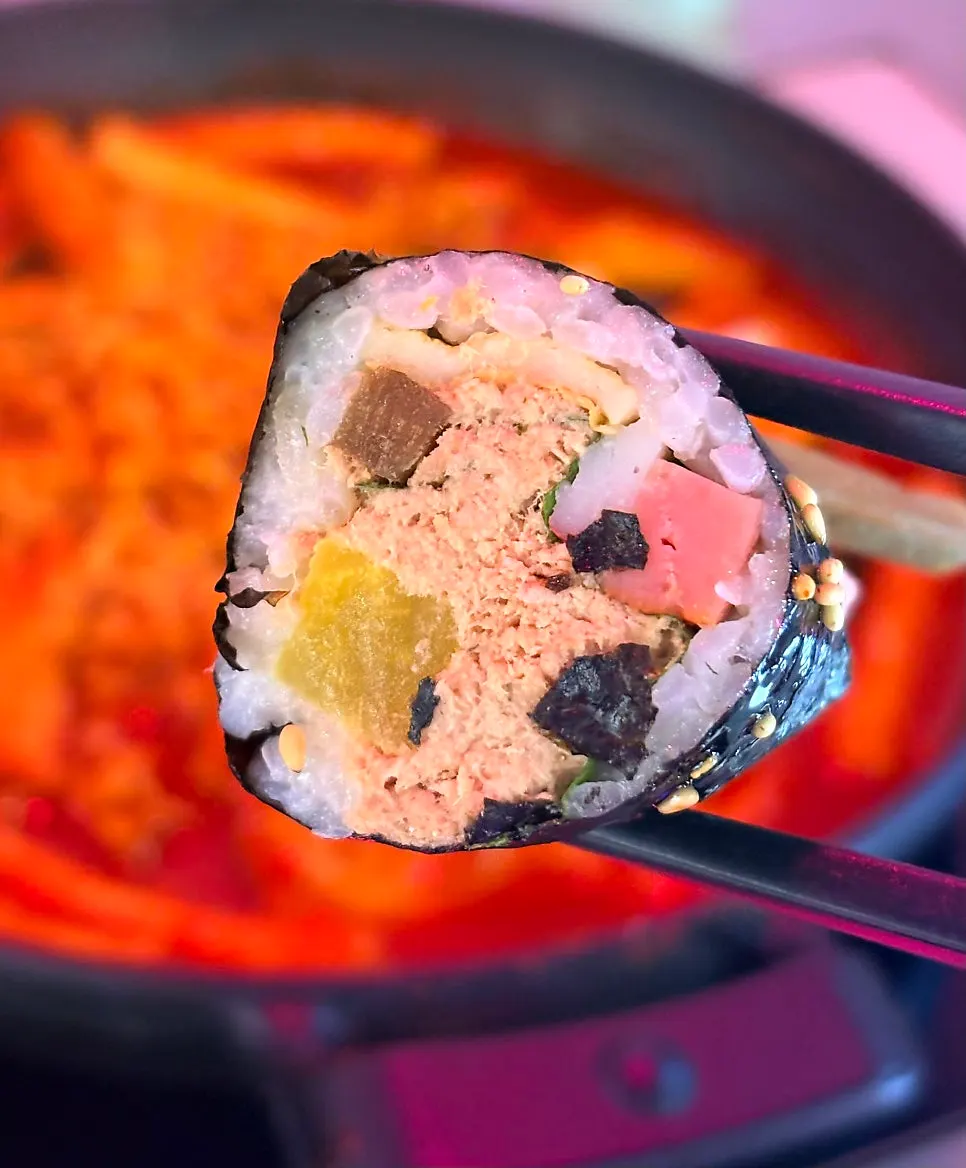 Cross-section of a tuna mini gimbap packed with filling