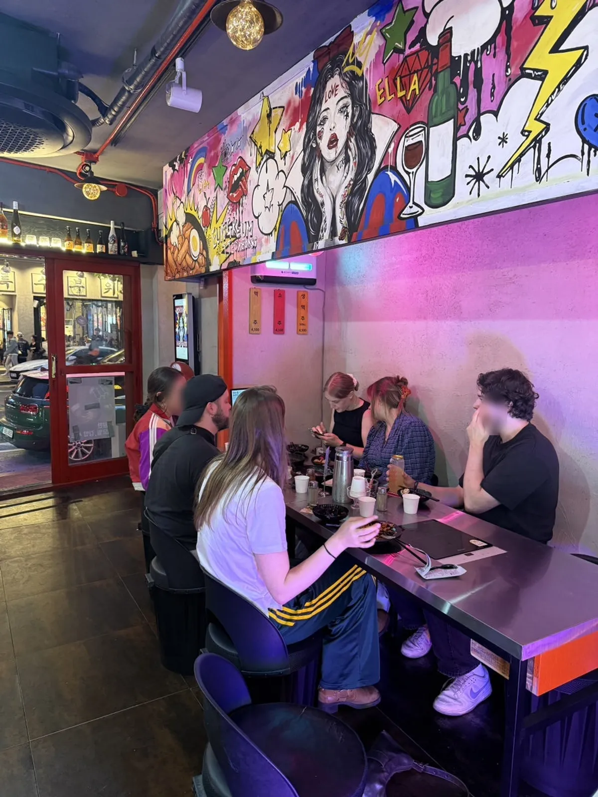Interior of Eungkeum Tteokbokki Yeonnam Branch with bold wall printing