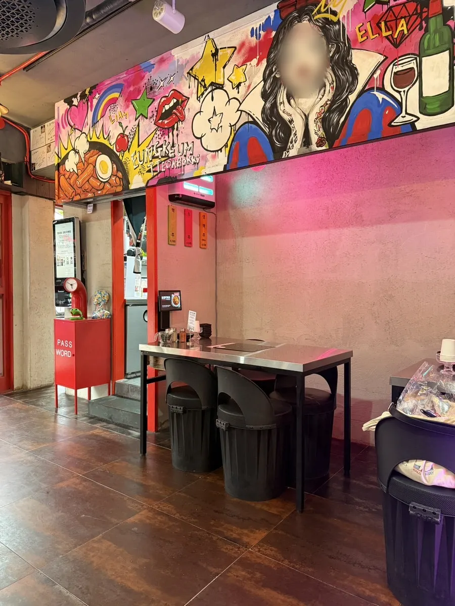 Chairs and table at Eungkeum Tteokbokki Yeonnam Branch with under-seat storage