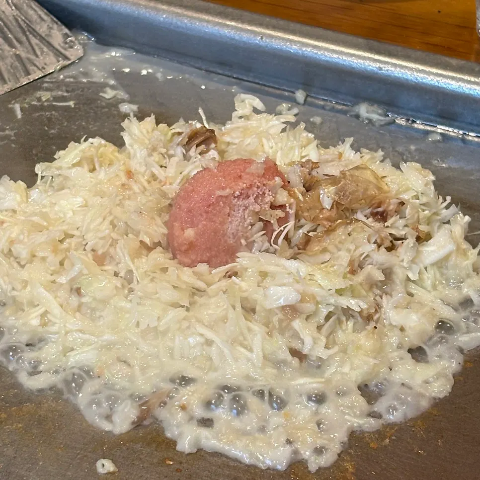 Staff member cooking mentaiko monjayaki