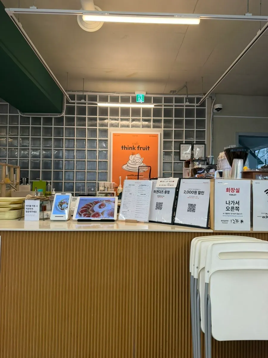Interior of Think Fruit with mostly white tables