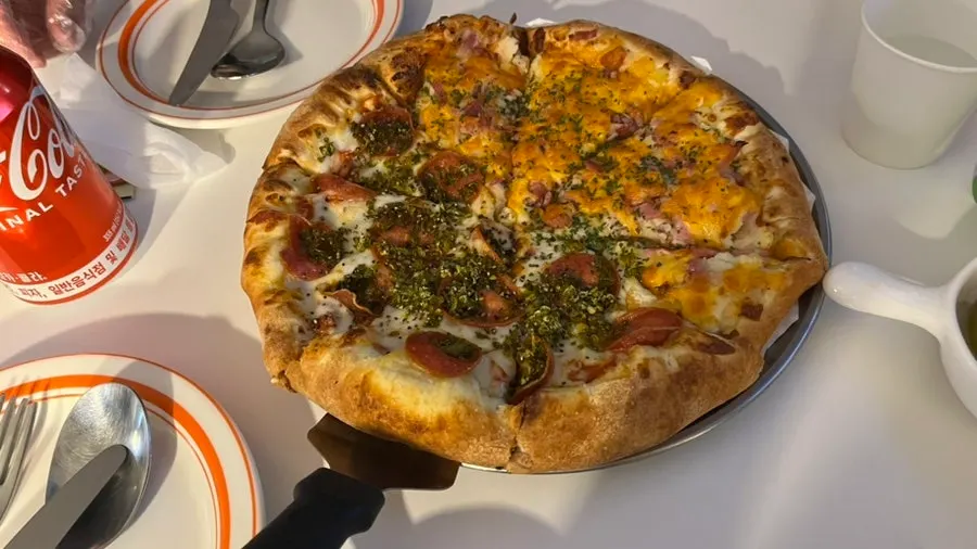 Freshly baked half-and-half pizza