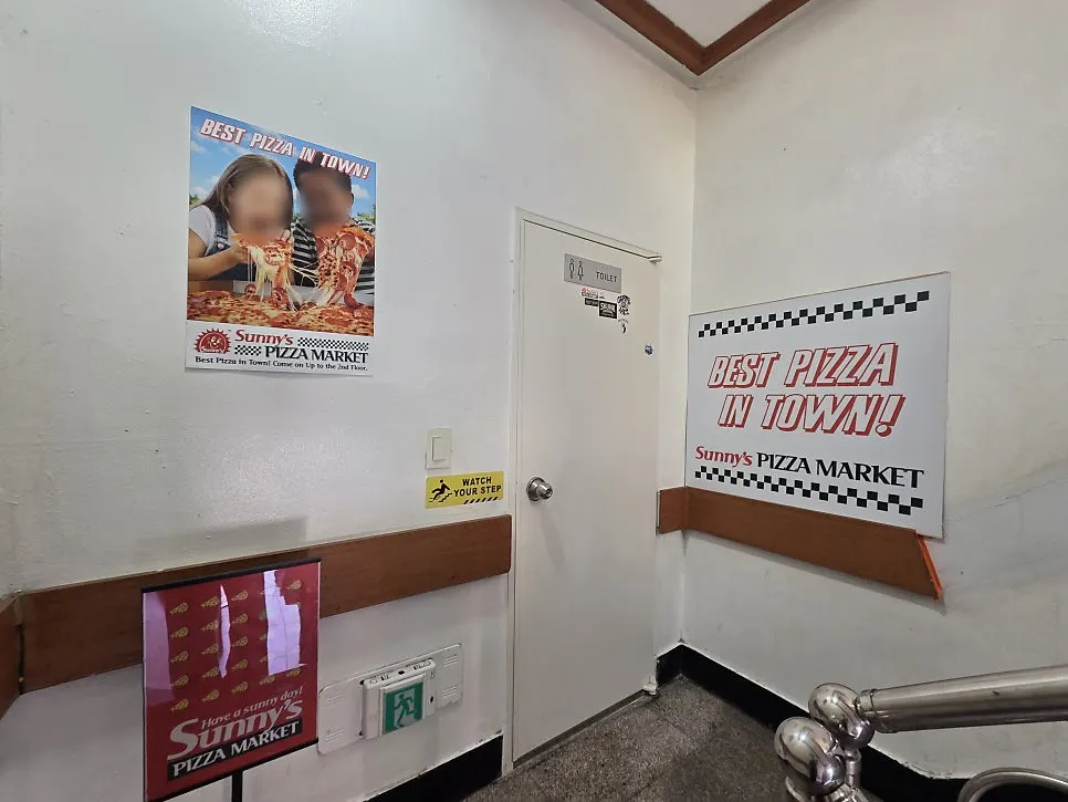 Street around the entrance of the Sunny's Pizza Market building
